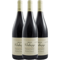 Three bottles of 2014 Volnay wine from Joseph Voillot on a green background